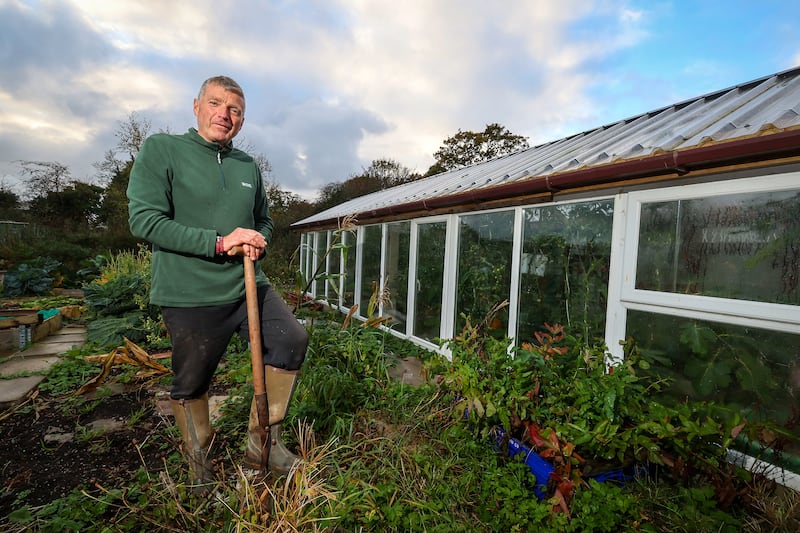 Paul Toner at his greenhouse at his home outside Crumlin, Antrim Council have told him to take down the greenhouse and existing garden sheds on the plot. PICTURE: MAL MCCANN