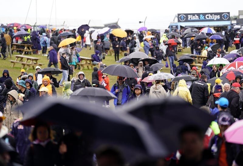 Spectators were under umbrellas ahead of the race at Silverstone on Sunday