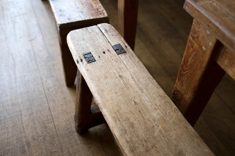 A vintage wooden bench seat with the added bonus of