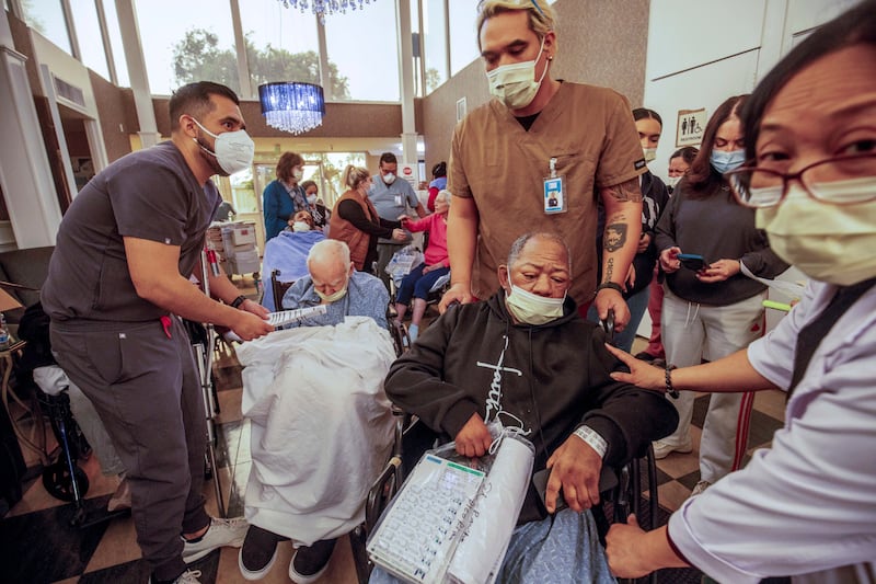 Residents are evacuated from a senior living facility (Ethan Swope/AP)