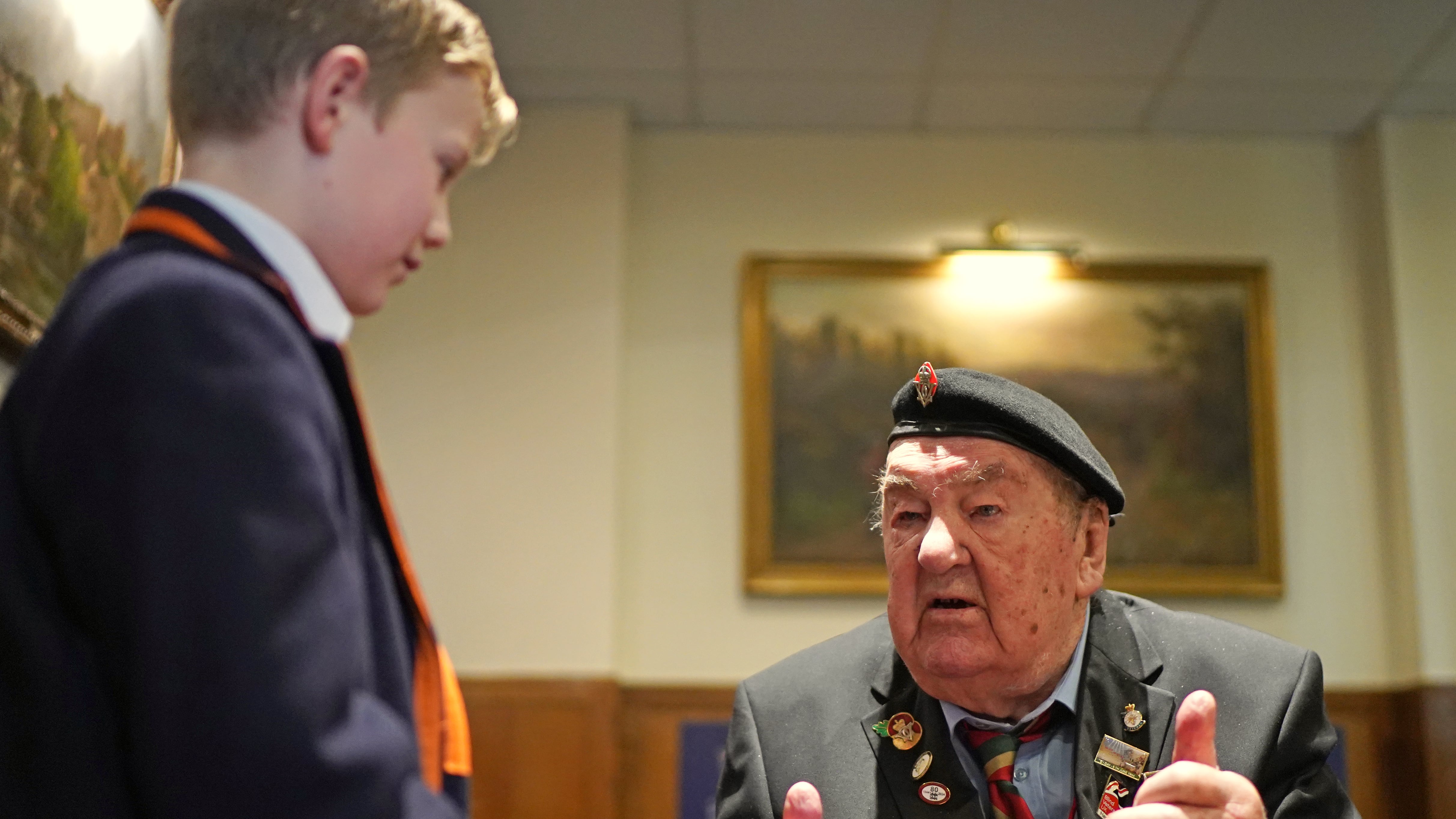 D-Day veterans Richard Aldred, 99, who served with the 7th Armoured Division of Royal Tank Regiment, meeting pupils from Norfolk House School
