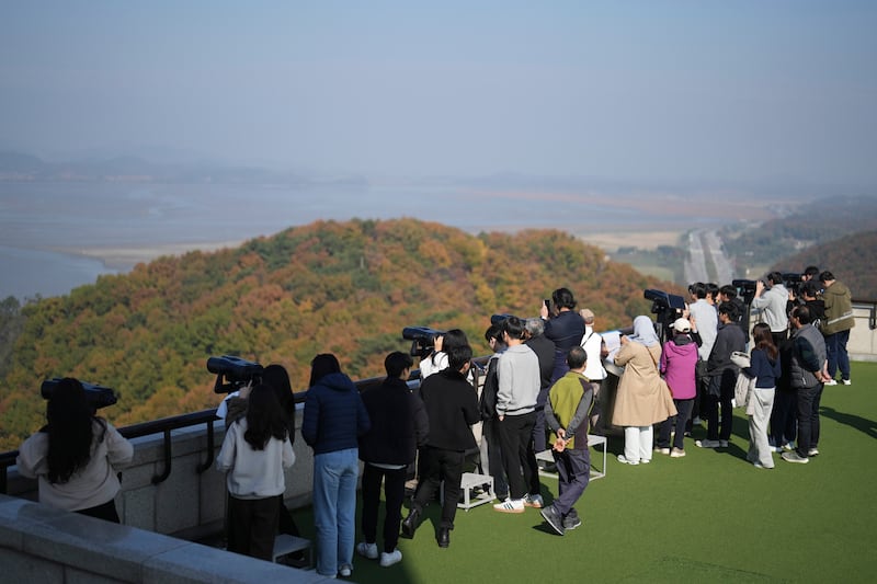 Visitors look at the North Korean side from the unification observatory in Paju, South Korea (Lee Jin-man/AP)