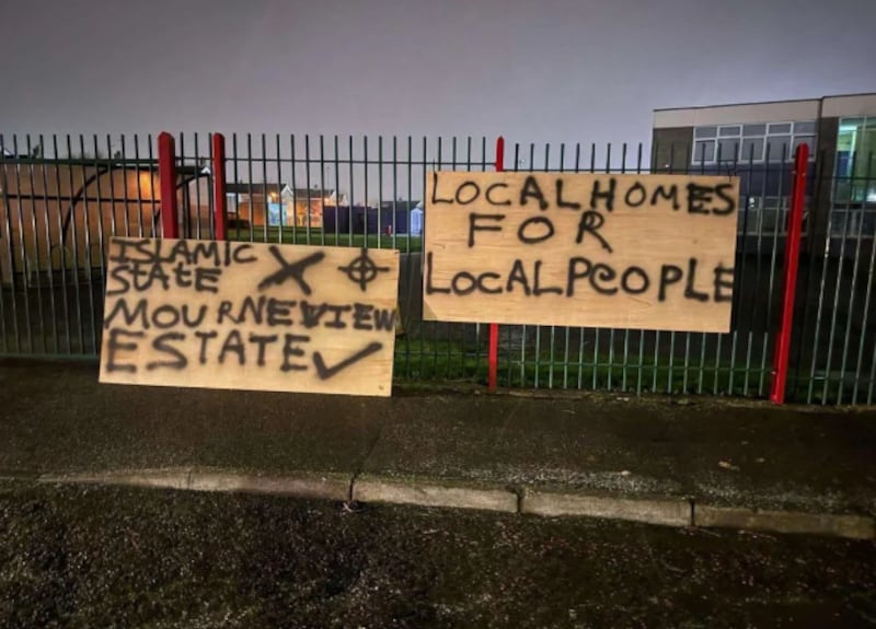 Signs erected outside a primary school in the Mourneview Estate in Lurgan