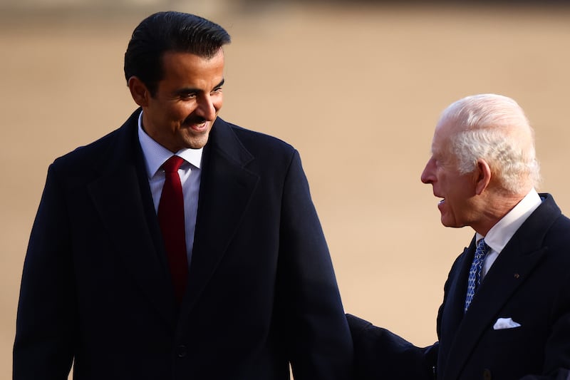 King Charles and the Emir of Qatar Sheikh Tamim bin Hamad Al Thani inspect a guard of honour during a ceremonial welcome at Horse Guards Parade. Henry Nicholls/PA