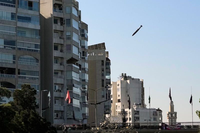 A bomb dropped from an Israeli jet prepares to hit a building in Tayouneh, Beirut (Hassan Ammar/AP)