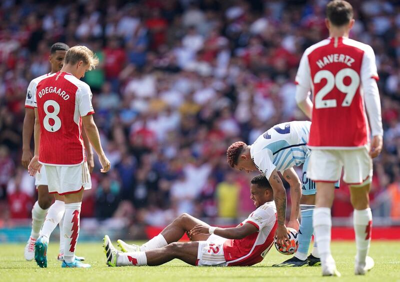 Timber, centre, ruptured his ACL on his Premier League debut in August