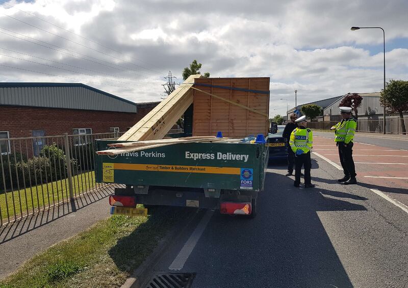 Handout photo issued by Police by the Travis Perkins lorry on the A26 in Newhaven, East Sussex on May 13 2020 after timber fell killing Jack Stevens