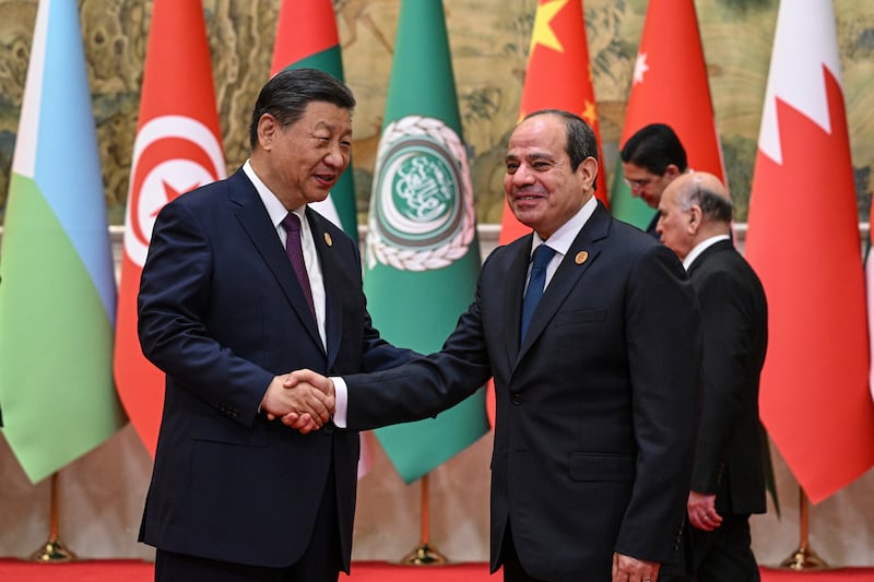 China’s President Xi Jinping shakes hands with Egypt’s President Abdel Fattah el-Sisi ahead of the China-Arab States Cooperation Forum (Jade Gao/Pool/AP)