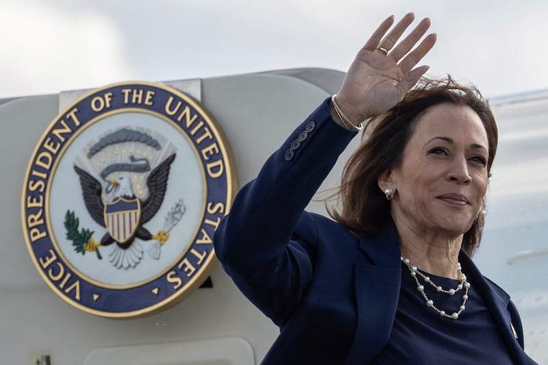 Democratic US presidential nominee Vice President Kamala Harris waves as she boards Air Force Two at LaGuardia International Airport (Yuki Iwamura/AP)