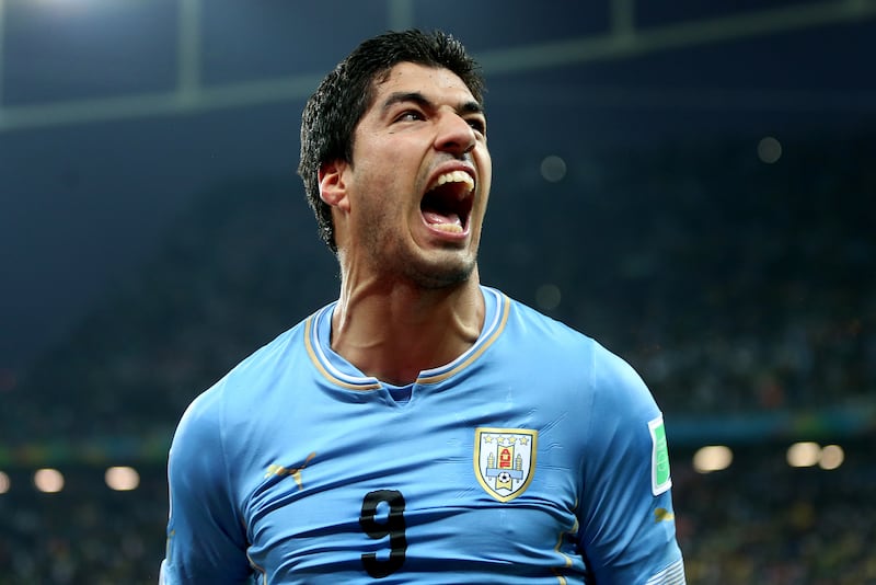 Luis Suarez celebrates one of his 69 goals for Uruguay