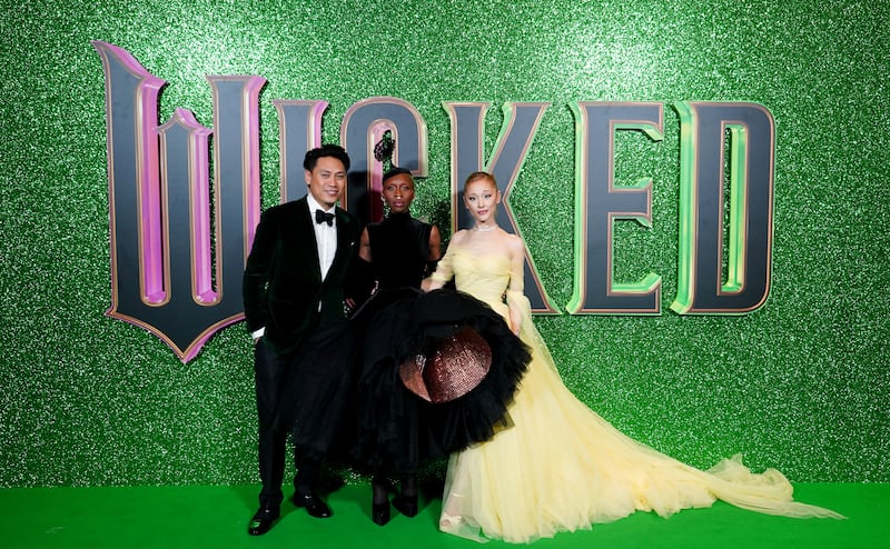 Director Jon M Chu (left), Cynthia Erivo (centre) and Ariana Grande at the UK premiere of Wicked