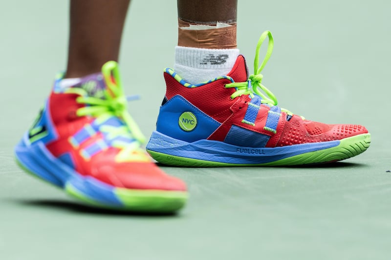 Coco Gauff often sports high top court shoes