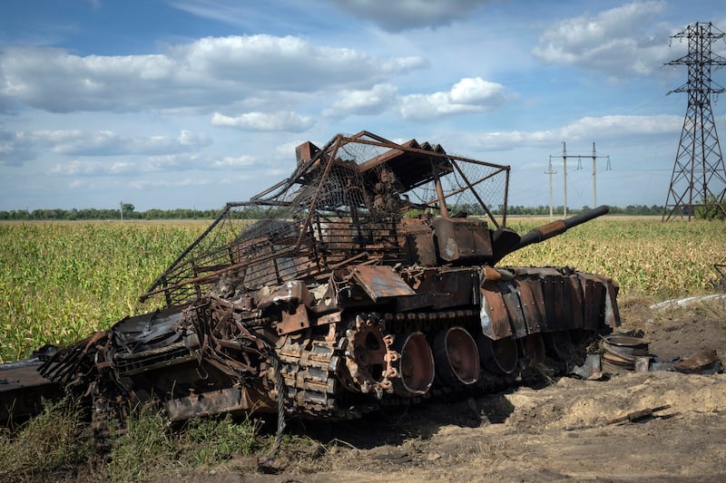 A destroyed Russian tank sits on a roadside near the town of Sudzha, in the Kursk region of Russia (AP)