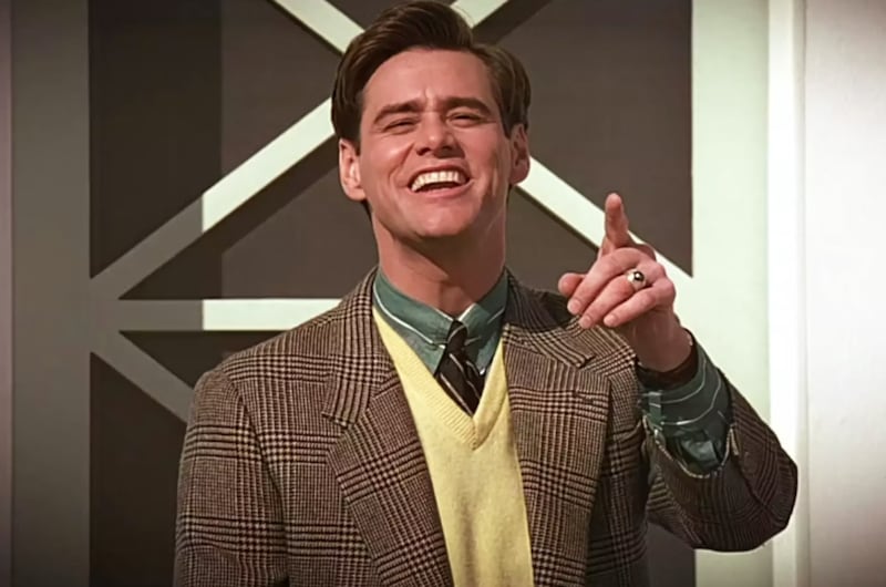 Jim Carrey in The Truman Show standing at his door and pointing