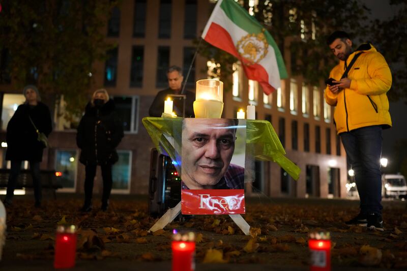 People commemorate Iranian-German Jamshid Sharmahd during a protest following his execution in Iran (Markus Schreiber/AP)