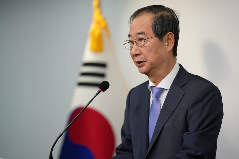 Prime Minister Han Duck-soo speaks during the joint statements after Yoon Suk Yeol avoided an opposition-led attempt to impeach him (Lee Jin-man/AP)