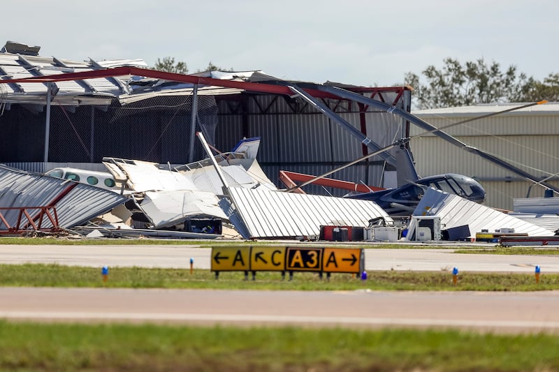 Hangars at Albert Whitted Airport were damaged by winds from Hurricane Milton (Mike Carlson/AP)