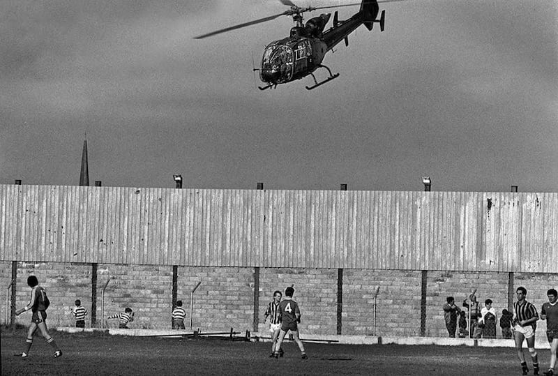 An army helicopter flies over the Crossmaglen Rangers ground during the 1986 Ulster club championship. 