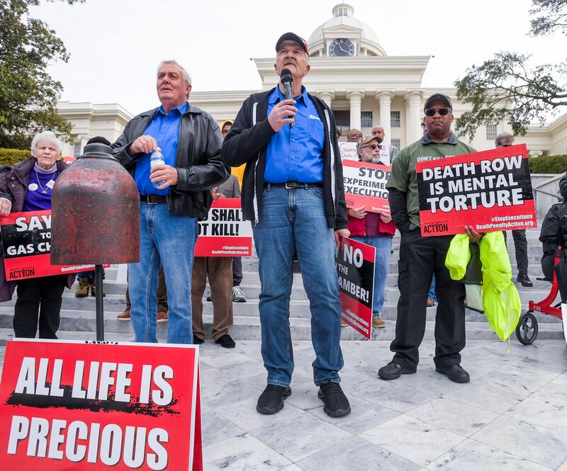 Former death row inmates who were exonerated, from left, Randall Padgent, Gary Drinkard and Ron Wright, were among the nearly 100 protestors gathered at the state capitol building in Montgomery, Alabama to ask Governor Kay Ivey to stop the planned execution of Kenneth Eugene Smith (Mickey Welsh/The Montgomery Advertiser via AP)