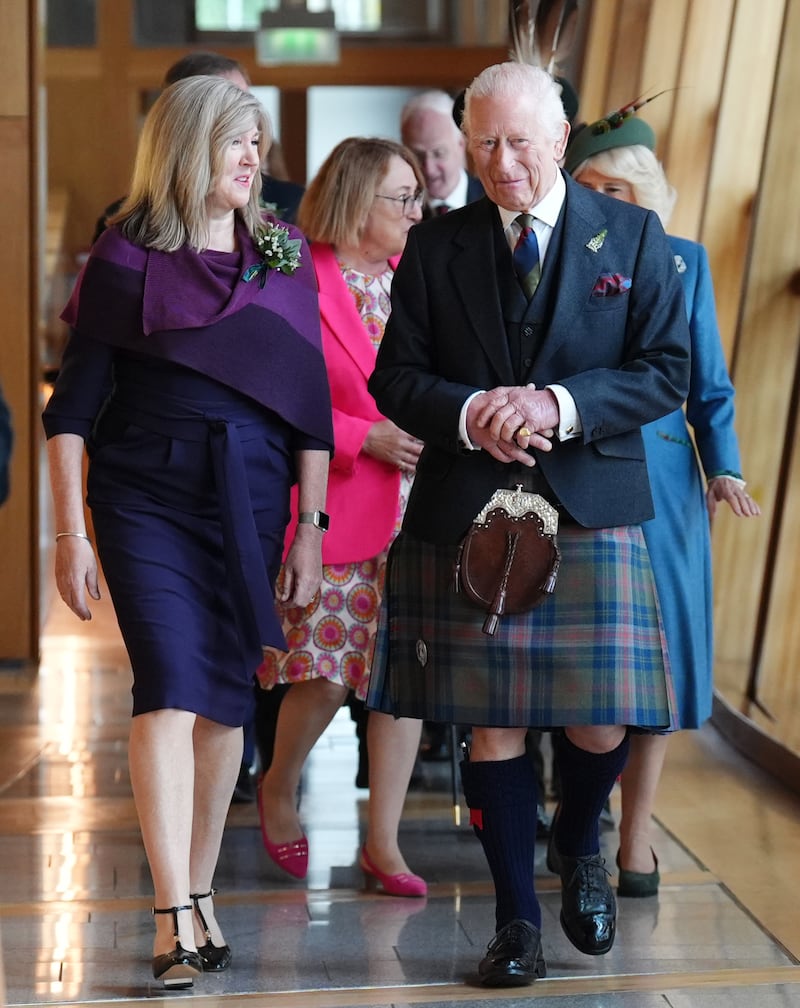 The King dressed in a kilt during a visit to the Scottish Parliament in Edinburgh to mark its 25th anniversary