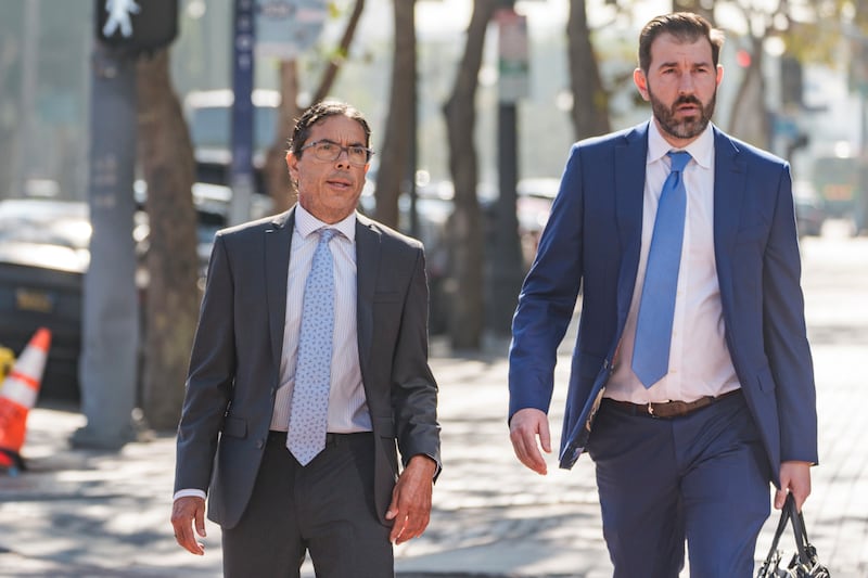 Mark Chavez (left) with his lawyer Matthew Binninger (Damian Dovarganes)