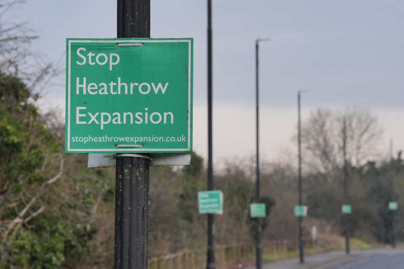 A “Stop Heathrow Expansion” sign is seen on a lamppost near Harmondsworth, one of the villages which would be affected