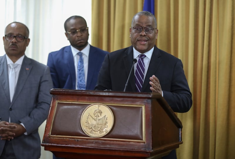 Garry Conille speaks to the press after his swearing-in ceremony (Odelyn Joseph/AP)