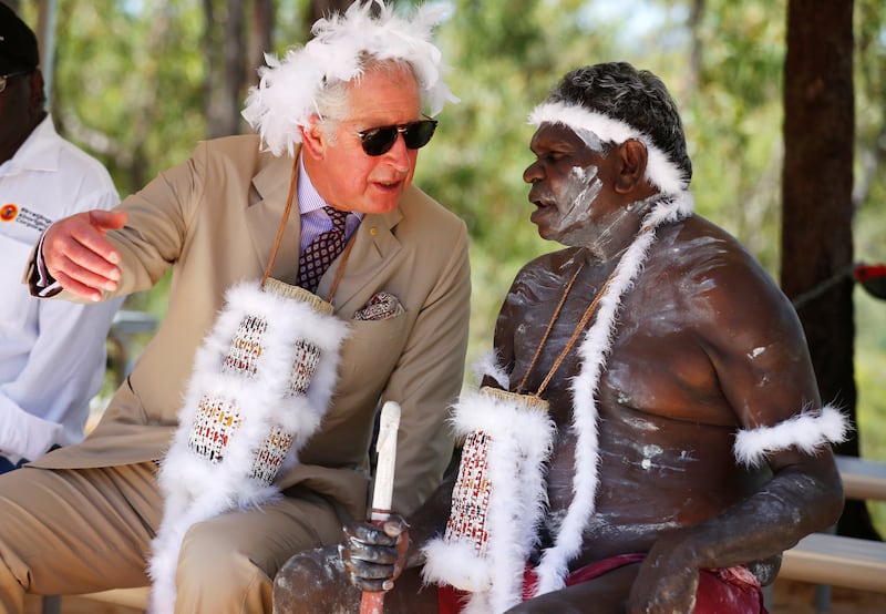 Charles wears a mulka string, a feather-stringed headband, during a visit to Mount Nhulun in 2018