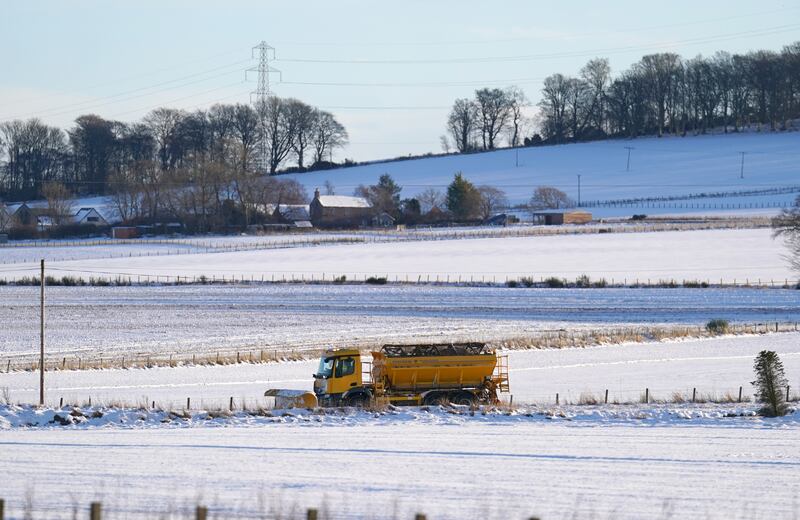 A snow plough clears a road near Fordoun in Aberdeenshire