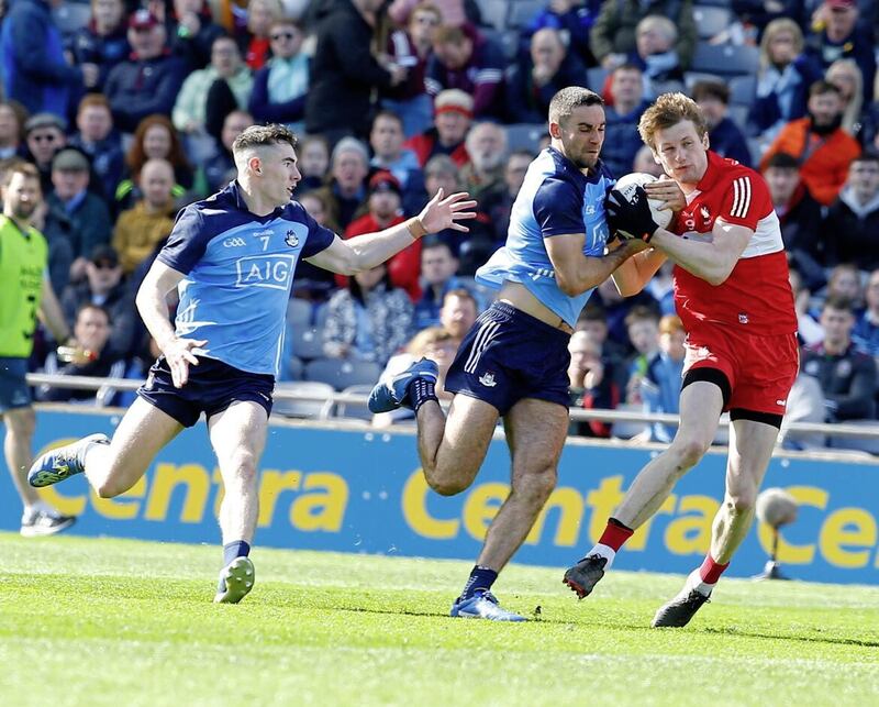 Dublin&#39;s James McCarthy and Derry&#39;s Brendan Rogers compete for possession during the Division Two Final. Pic Philip Walsh 
