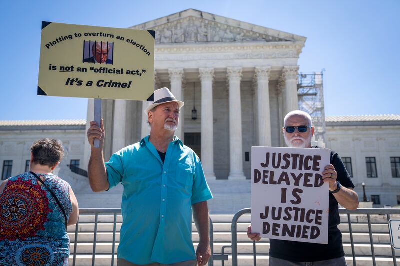 Protesters outside the Supreme Court in Washington, DC, on Monday (Jacquelyn Martin/AP)