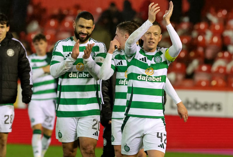 Celtic’s Callum McGregor applauds the fans at Pittodrie