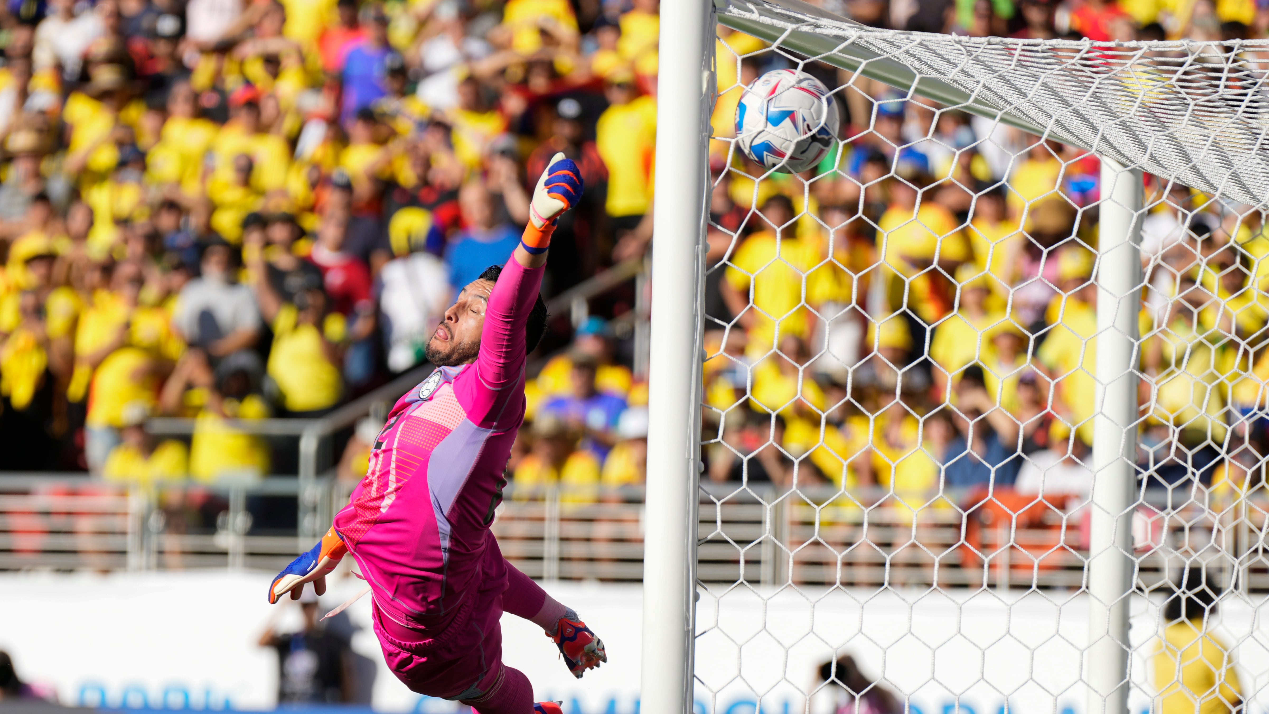 Colombia’s goalkeeper David Ospina fails to stop a free kick from Brazil’s Raphinha (Tony Avelar/AP)