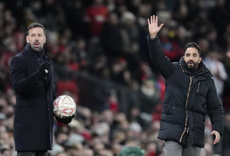 Ruben Amorim (right) and Ruud van Nistelrooy on the touchline