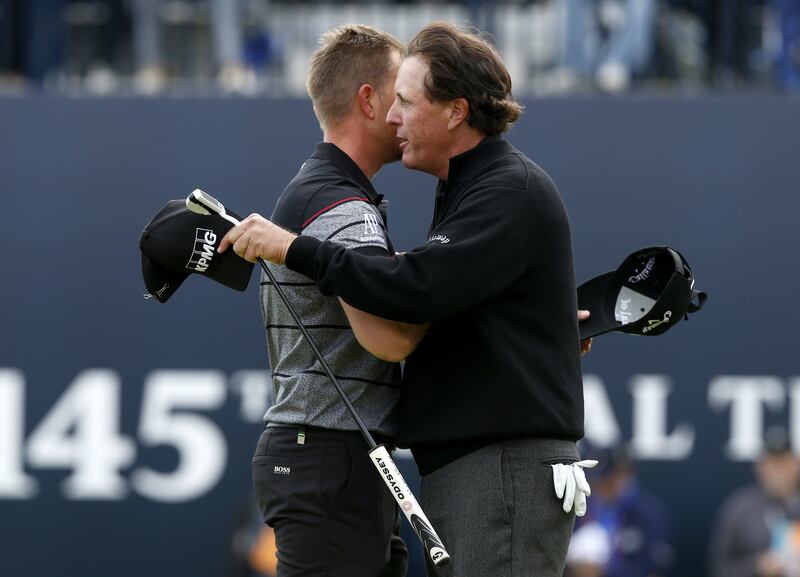 Henrik Stenson, left, hugs Phil Mickelson as he celebrates winning the 2016 Open at Royal Troon