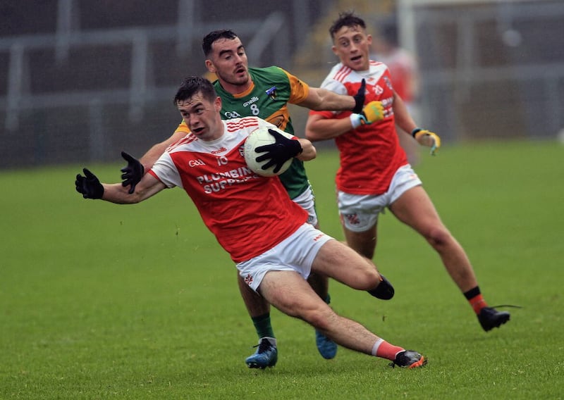 Declan Loye tackles Clann Eireann&#39;s Dan McCarthy at the Athletic Grounds. Picture: Seamus Loughran. 