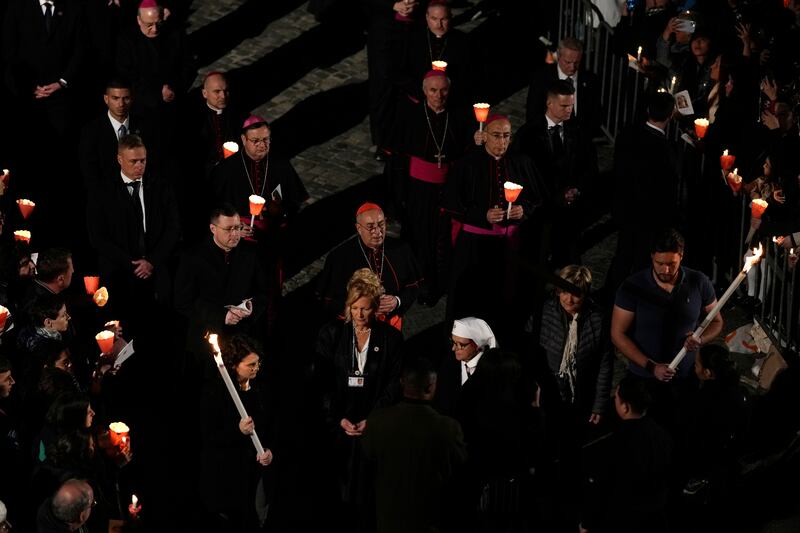 Vicar General Cardinal Angelo De Donatis presides over the Via Crucis in front of the Colosseum in Rome (AP Photo/Andrew Medichini)