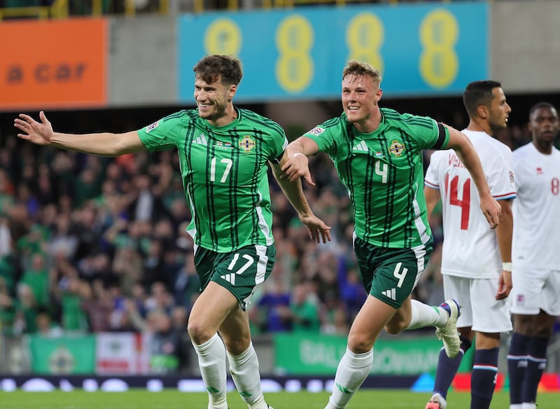 Daniel Ballard (right) races to congratulate Paddy McNair on his opening goal against Luxembourg for Northern Ireland.