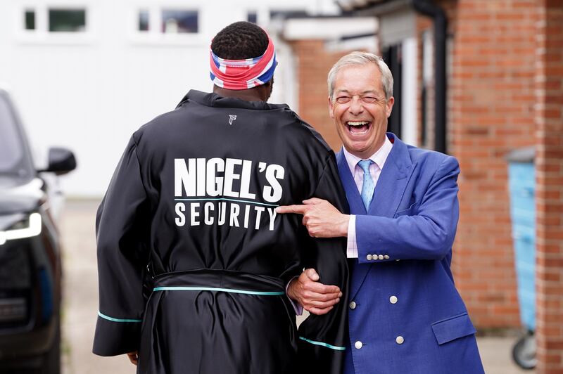 Reform UK leader Nigel Farage and boxer Derek Chisora
