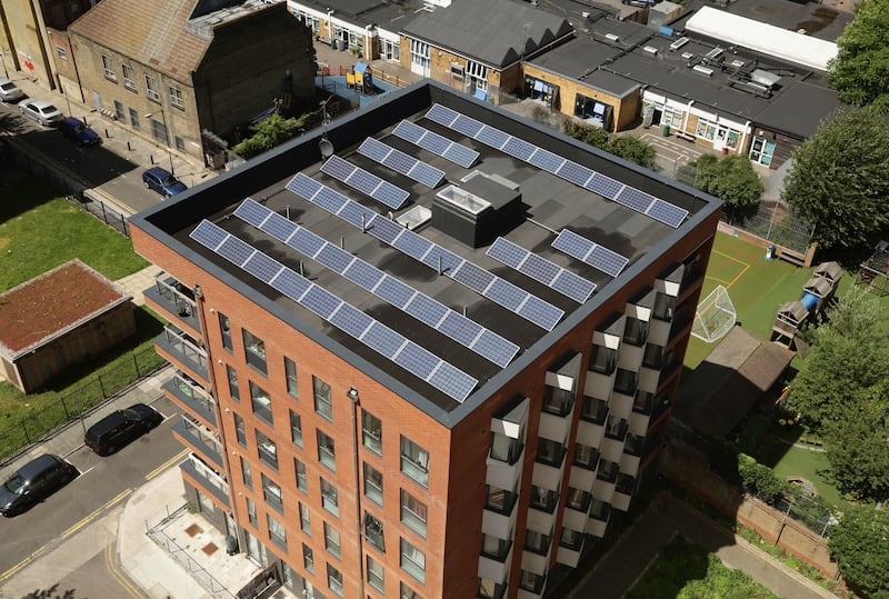 Solar panels on the roof of an apartment block in Bethnal Green, east London