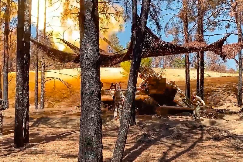 Russian soldiers fire from a 203-mm self-propelled gun 2S7 ‘Pion’ in an undisclosed location in Ukraine (Russian Defense Ministry Press Service/AP)