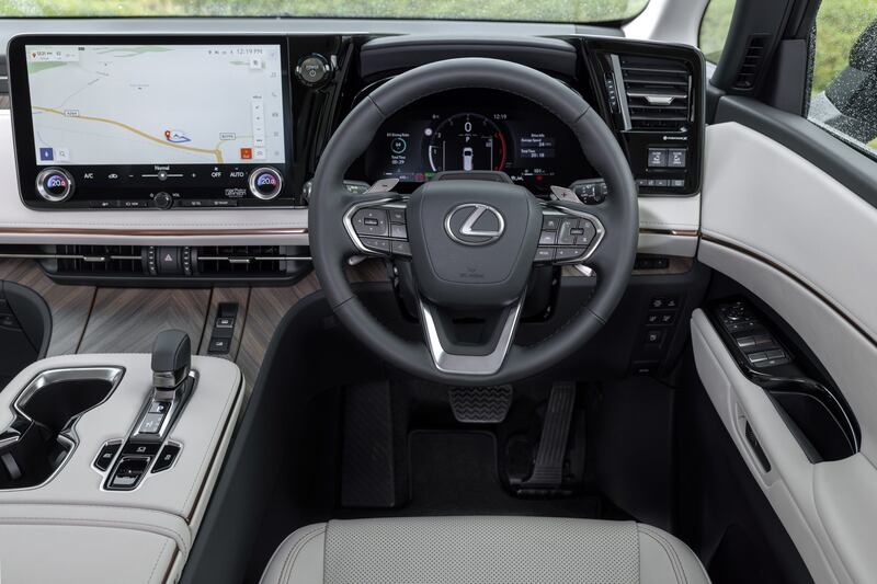 The interior features pale wood and lots of leather upholstery. (Lexus)