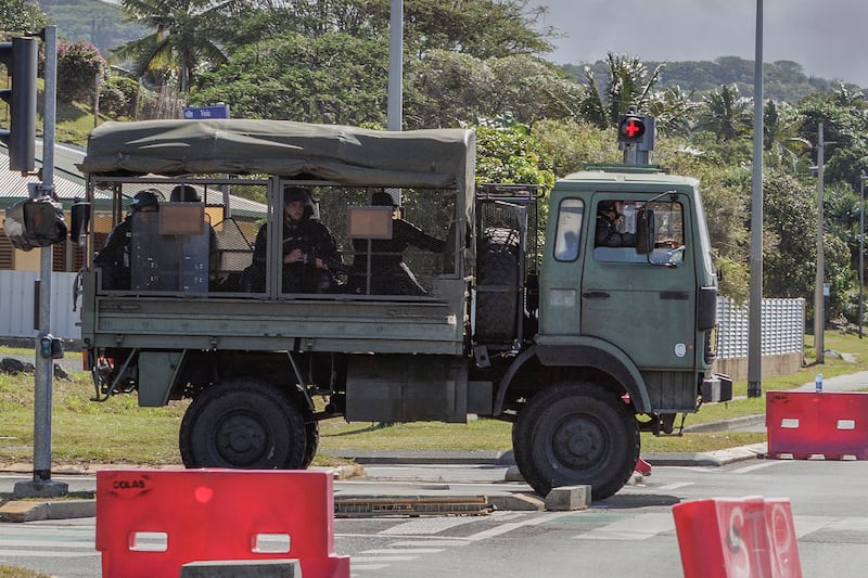French police patrol the streets in Noumea (Cedric Jacquot/AP)