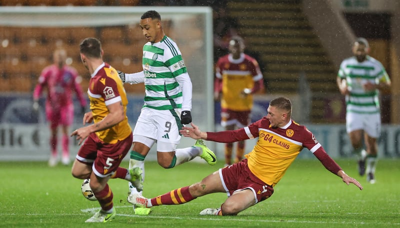 Celtic’s Adam Idah is tackled by Motherwell’s Liam Gordon