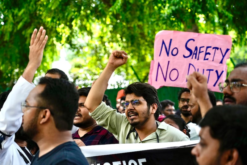 Doctors and paramedics protest in front of the Indian health minister’s office in New Delhi (Manish Swarup/AP)