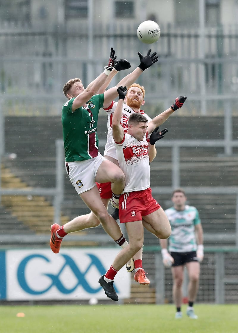 Conor Glass and Ciaran McFaul contest a kickout during Derry's win against Westmeath last Saturday. Picture: Margaret McLaughlin