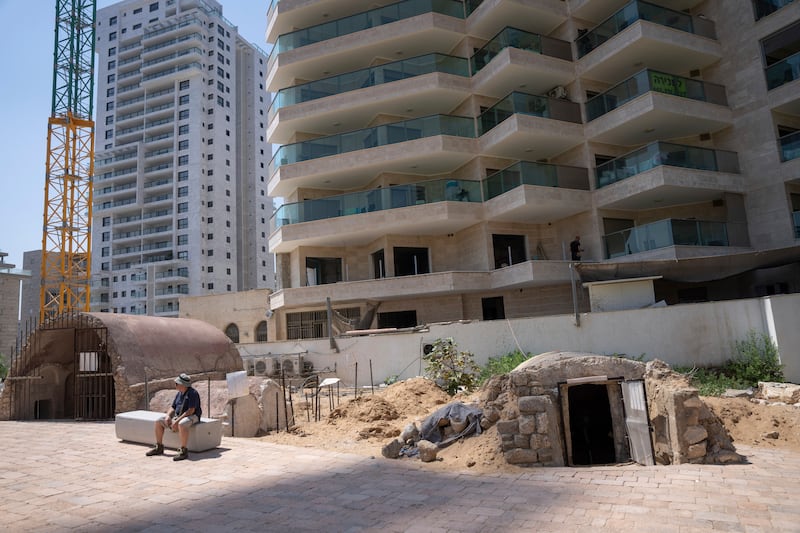 The tombs are surrounded by flats in Ashkelon (Ohad Zwigenberg/AP)