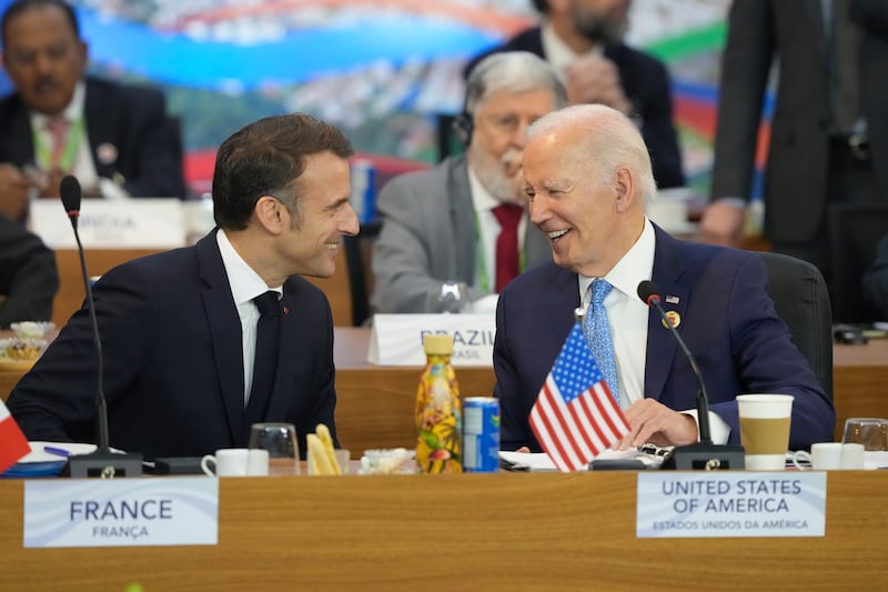 US President Joe Biden, right, and France’s President Emmanuel Macron talk during the G20 Summit (AP Photo/Eraldo Peres)