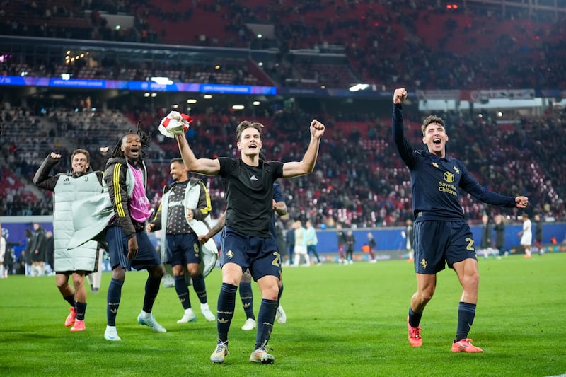 Juventus players celebrate after their come-from-behind win in Leipzig (AP/Ebrahim Noroozi)