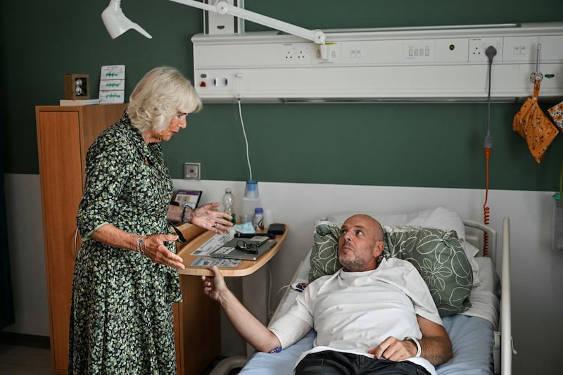 Camilla speaks to cancer patient Paul Holdway during her visit to the new centre